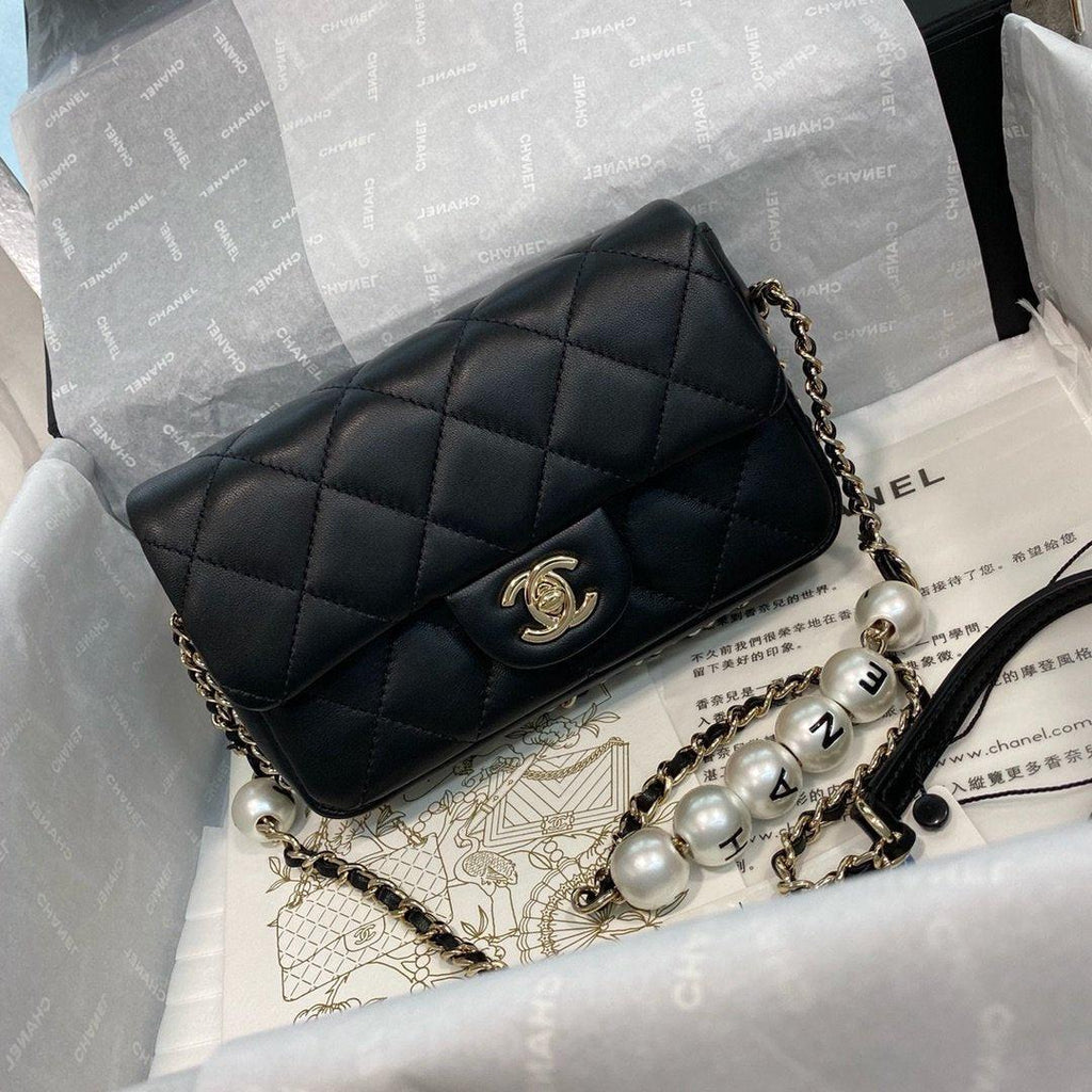 Chanel Pearl Logo Strap Flap Bag Black