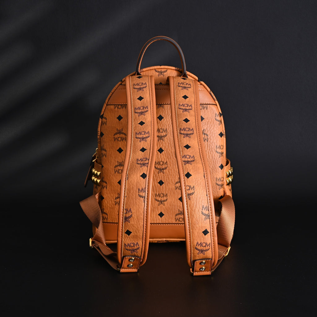 Mcm Stark Visetos Medium Backpack – Cognac Monogram with Gold-Tone Studs - Cognac with Black Monogram Print