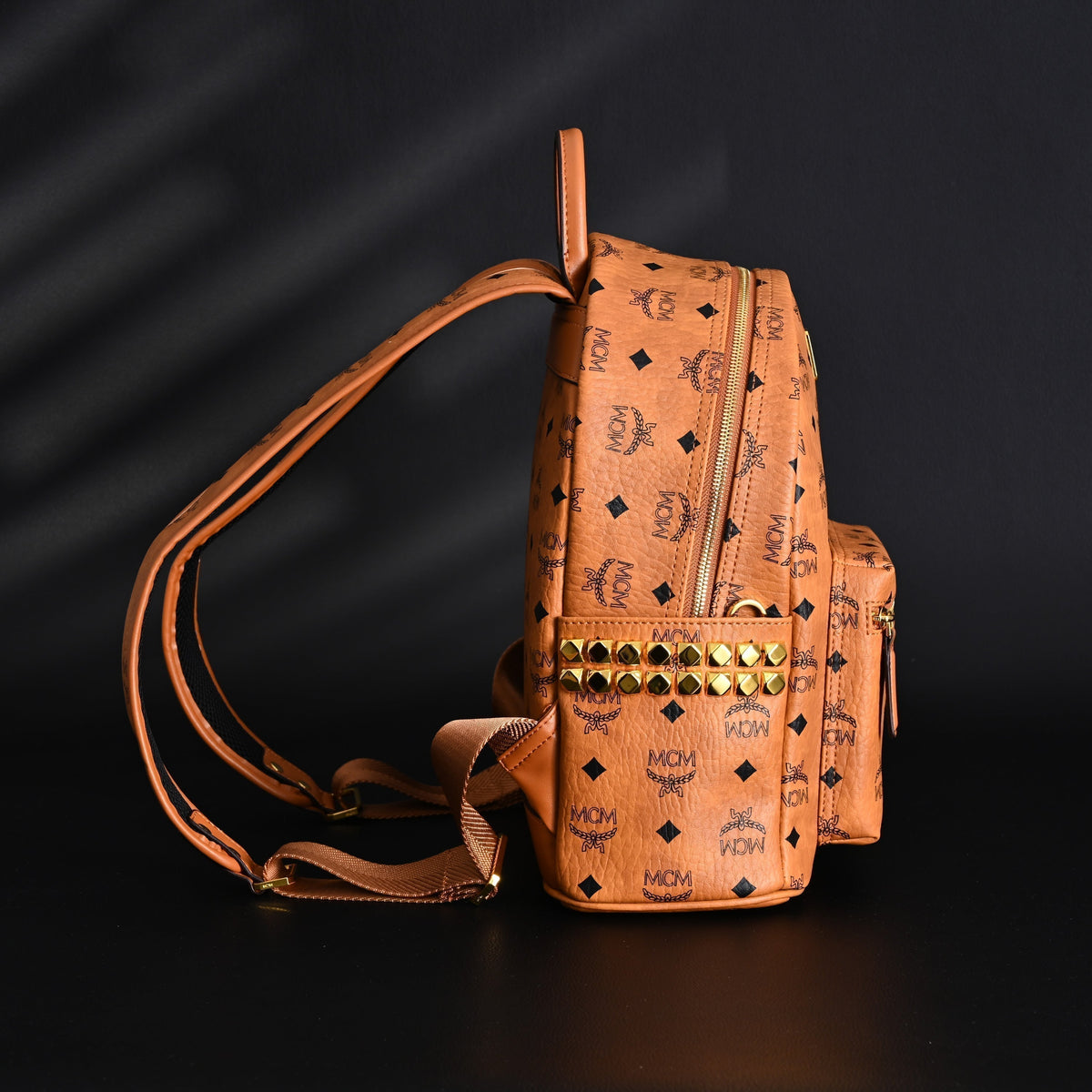 Mcm Stark Visetos Medium Backpack – Cognac Monogram with Gold-Tone Studs - Cognac with Black Monogram Print